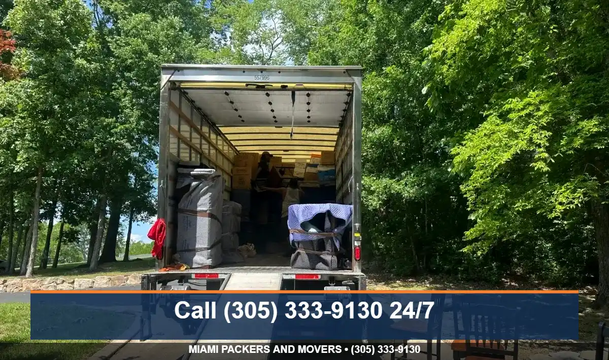 JM Moving box truck with ramp down, ready for a discounted Miami move